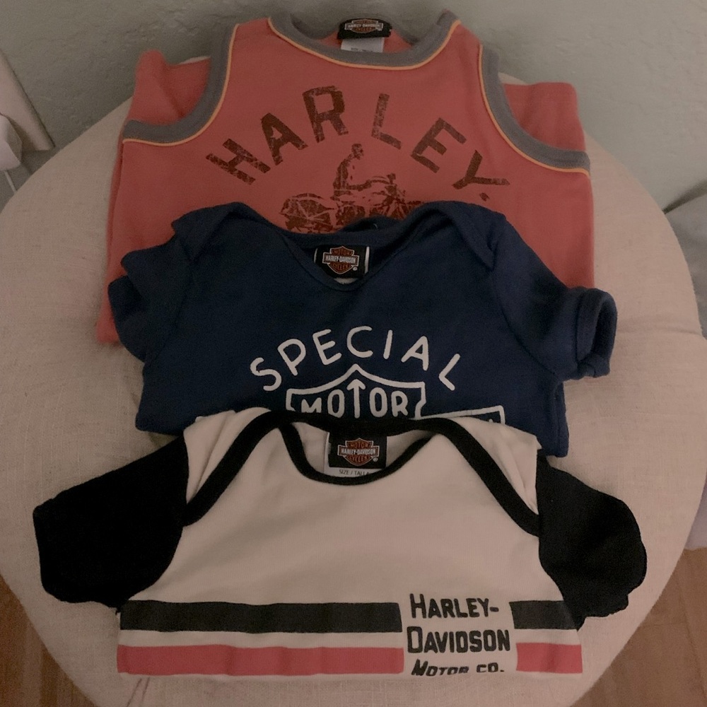Like new set of 3 Harley Davidson onesies. Black, orange, cream & blue.